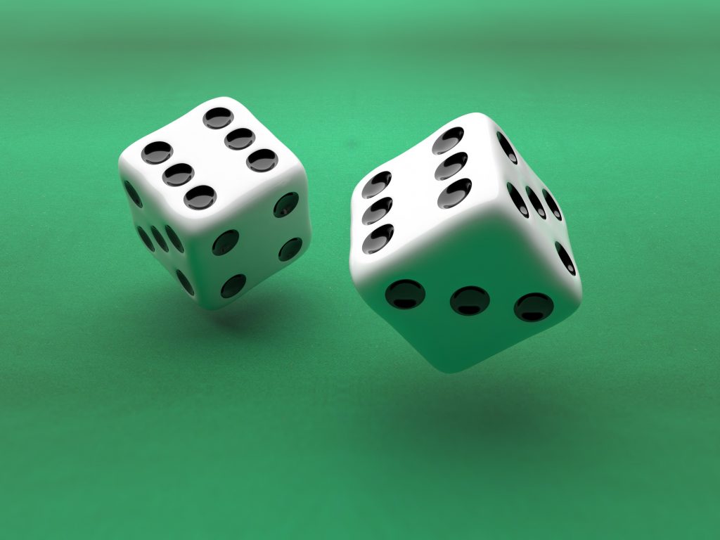 dice flying over green felt background min 4x3 1